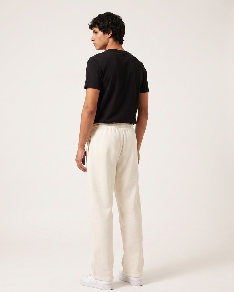 Clueless jogger in cream, script and aircraft mark on the thigh