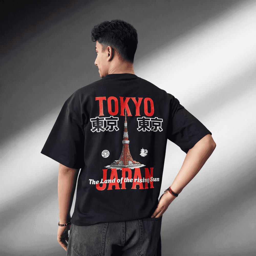 Tokyo City oversized tee in black, back print, worn by a model
