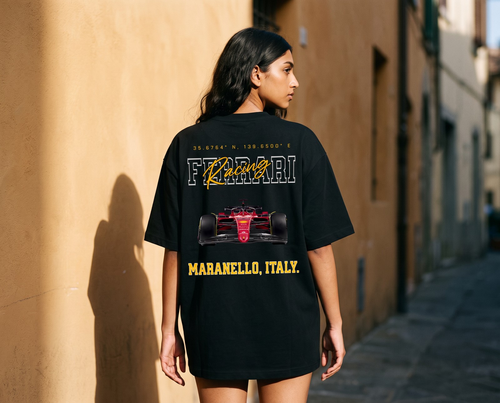 Model seen from behind on an Italian street wearing the Maranello Racing oversized tee, Ferrari Racing back print